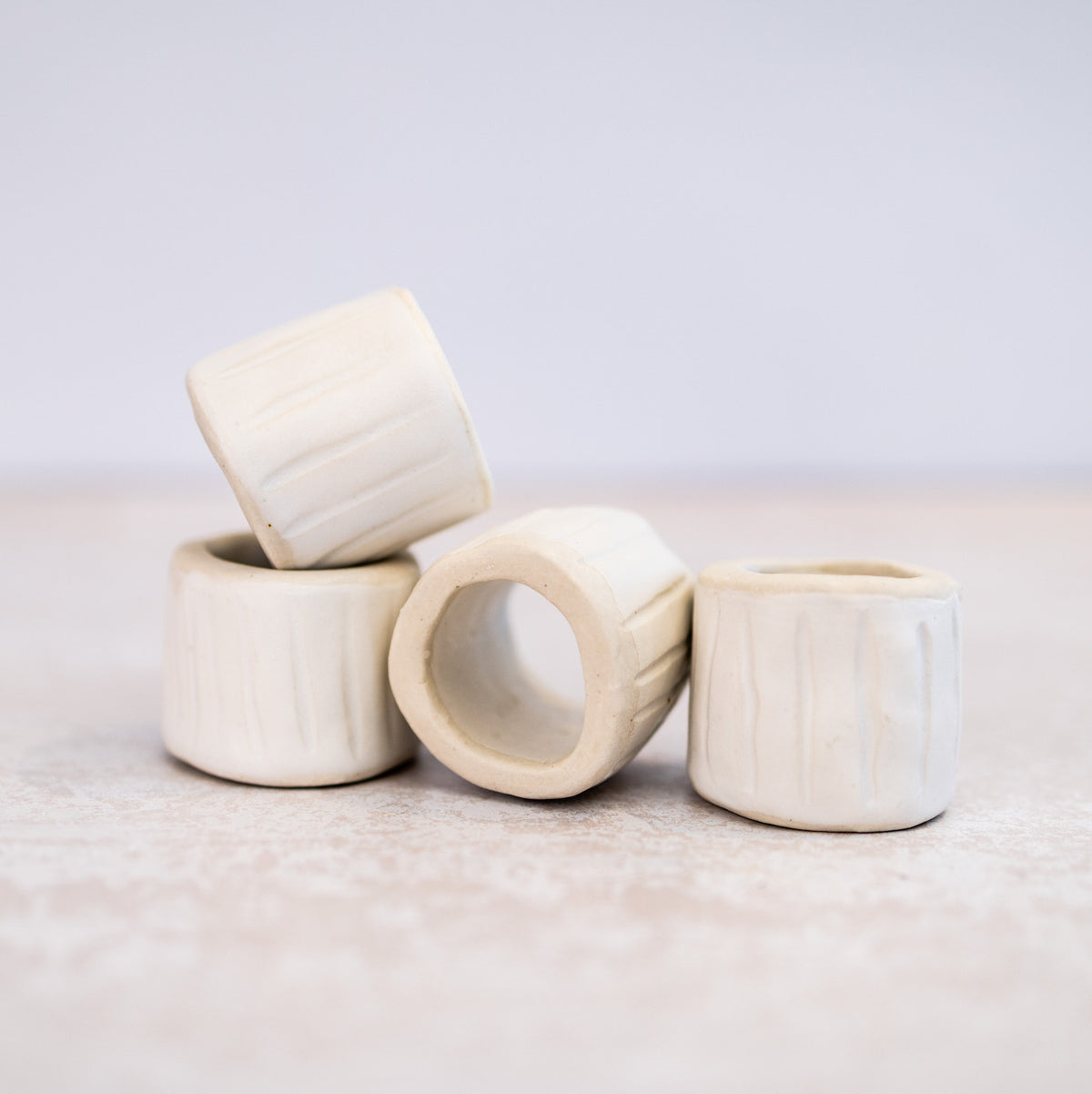 HANDMADE CERAMIC NAPKIN RINGS (SET OF 4) Ink Spiller Home
