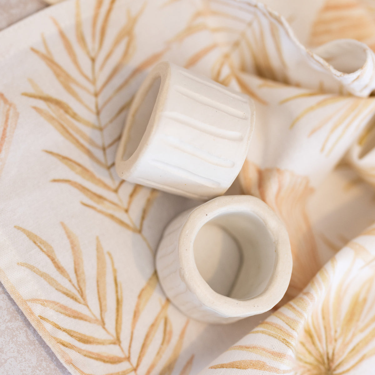 HANDMADE CERAMIC NAPKIN RINGS (SET OF 4) Ink Spiller Home
